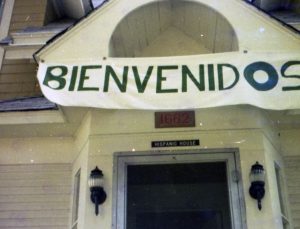 Bienvenidos banner above the front door of the Hispanic House