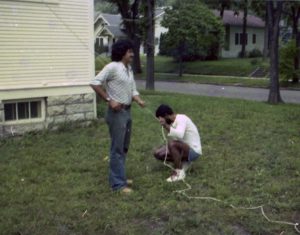 Two people standing outside the Hispanic House