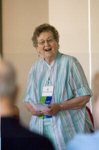 Standing member of the Class of 1951 at a forum in 2006