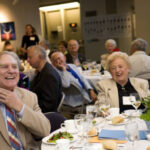 Seated members of the Class of 1951 at a dinner in 2006