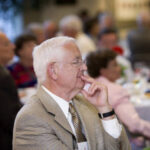 Seated member of the Class of 1951 at a dinner in 2006