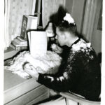 Man studying with snow inside dorm room class of 1961