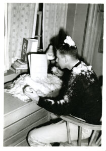 Man studying with snow inside dorm room class of 1961