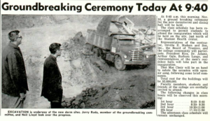 Picture of Jerry Ruda and Neil Lloyd looking over a dorm construction site with a dumptruck in the background