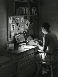 Yearbook Student Typing in Dorm 1966