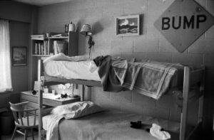 Photo of a room in Dayton Hall, with bunk beds and a desk