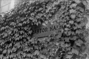 Photo of the Dayton Hall sign, surrounded by ivy