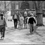 Mac in the Springtime; students walking in front of Carnegie Hall