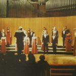 Students standing on risers performing in the Macalester Concert Choir Fall 1970