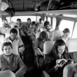 Macalester students sitting on a bus enroute to the March on Washington, November, 1969.