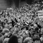 Large crowd of anti-war demonstrators inside at a Moratorium gathering 11/1969