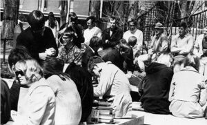 Groups of students sitting in front of the Student Union