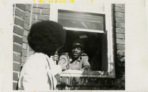 EEO Melvin Collins at window 1974