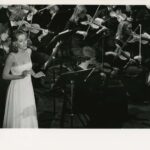 Dorothy singing with orchestra in the background