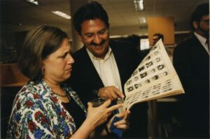 Two people looking at an old Spotlite