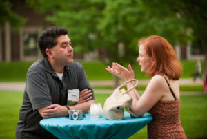 Brian Bull talking with another person at Reunion 2011