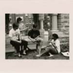 Four students in the Old Main portico 5/17/1989