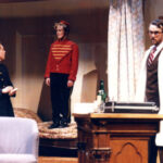 Three performers on stage in What the Butler Saw Spring 1988
