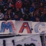 Photo of fans holding up a M A C sign at Women's Soccer 1989