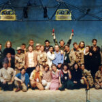 Cast of Iphigenia, performed Spring 1993, standing and kneeling in a large group on stage