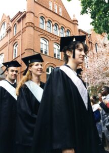 Three students in caps and gowns in procession at Commencement 1996