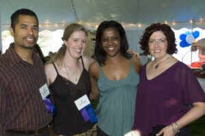 Four people standing together at the gathering of Class of 1996 at Reunion 2006