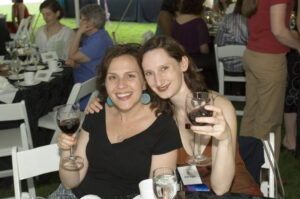 Two members of the Class of 1996 seated at a table at Reunion 2006