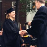 President Gavin shaking hands with a student at Commencement 1996