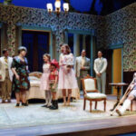 An image from the 2008 production Cat on a Hot Tin Roof. The cast is on stage performing a scene.