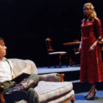 An image of two characters from the 2008 production of the Conduct of Life