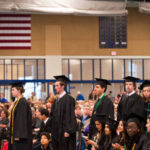 Students in the field house during commencement