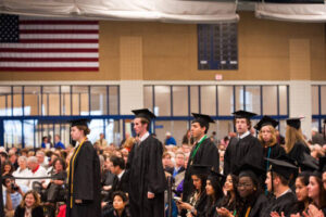 Students in the field house during commencement