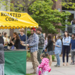 Students lined up for the roasted corn booth