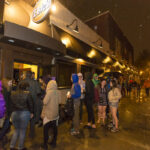 Students lined up outside of Elsie's in the rain