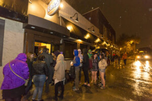 Students lined up outside of Elsie's in the rain