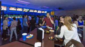 Students gathered in the lounge of the bowling alley